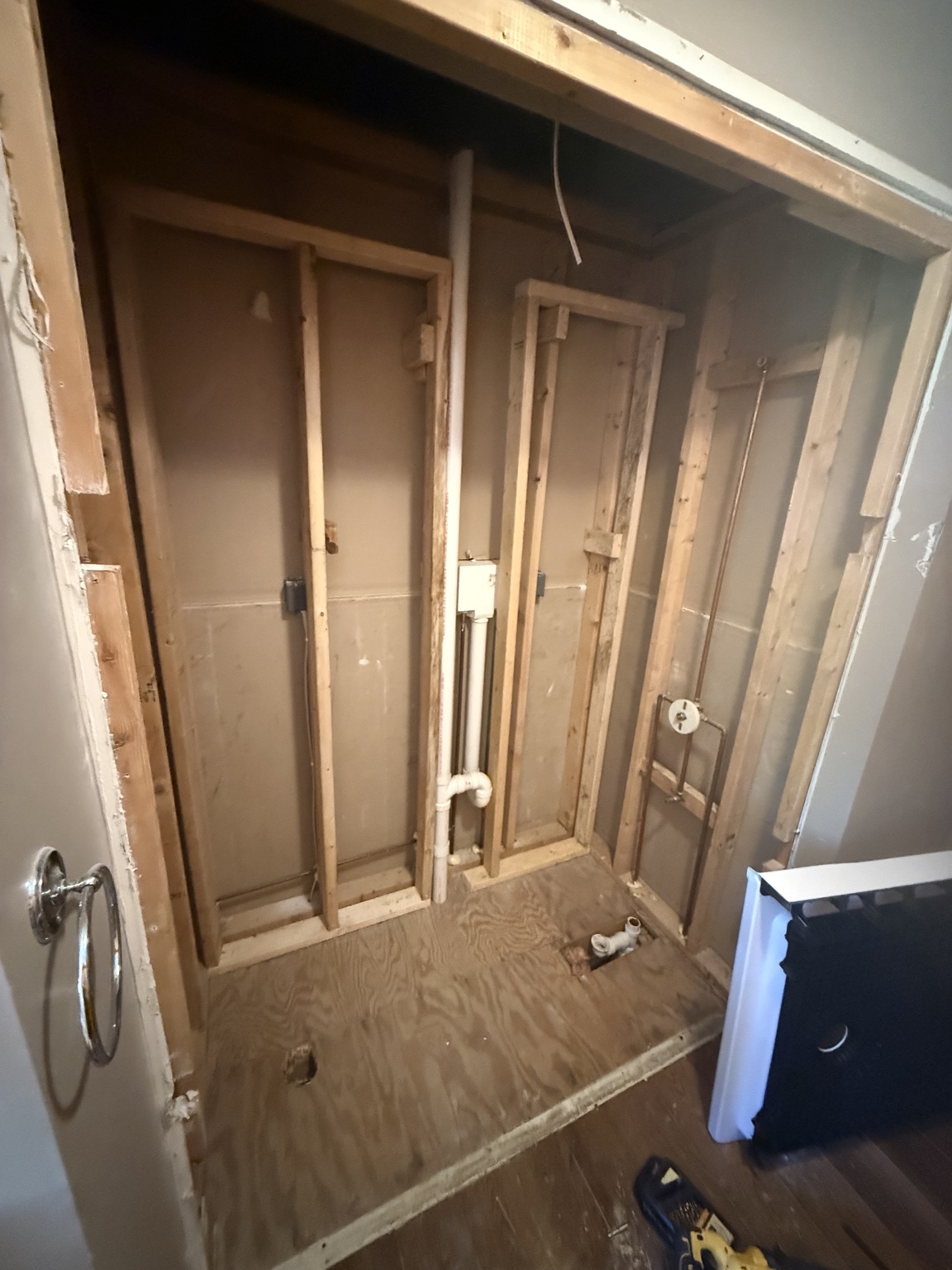 Bathroom shower area during renovation before new shower installation